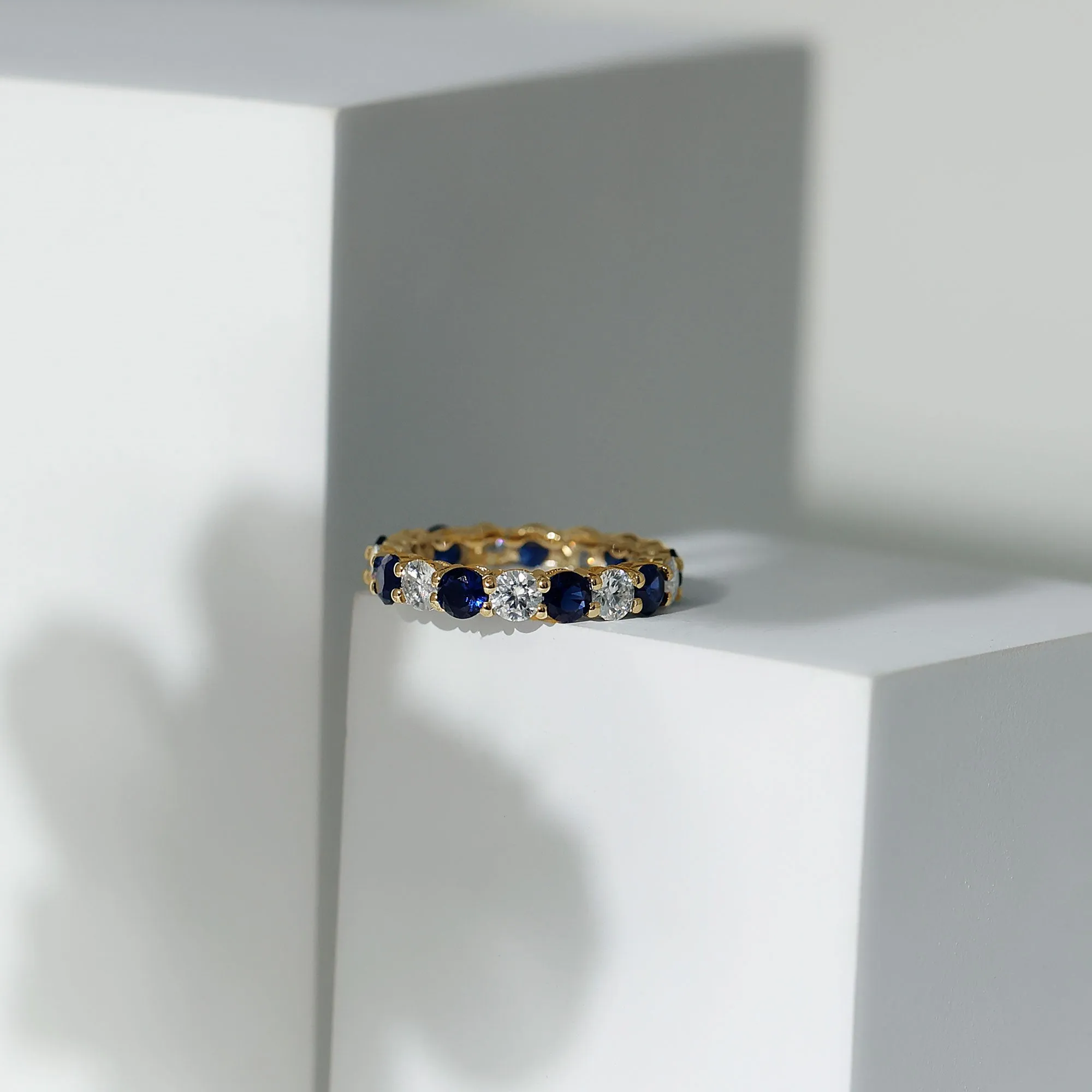 Alternating Created Blue Sapphire and Moissanite Eternity Ring